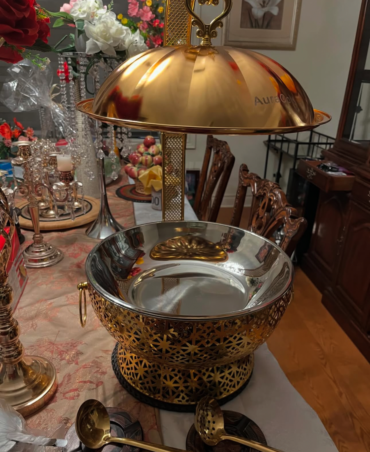 Gold chafing dish with ornate filigree base