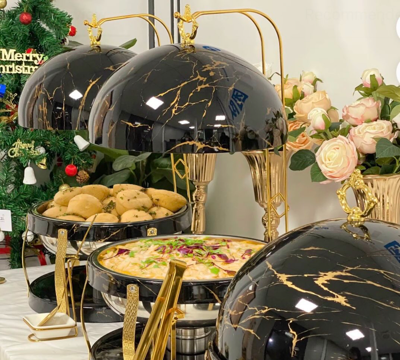 Black marble chafing dishes with gold accents